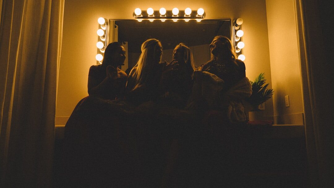 Group of friends streaming a show together on a couch at night