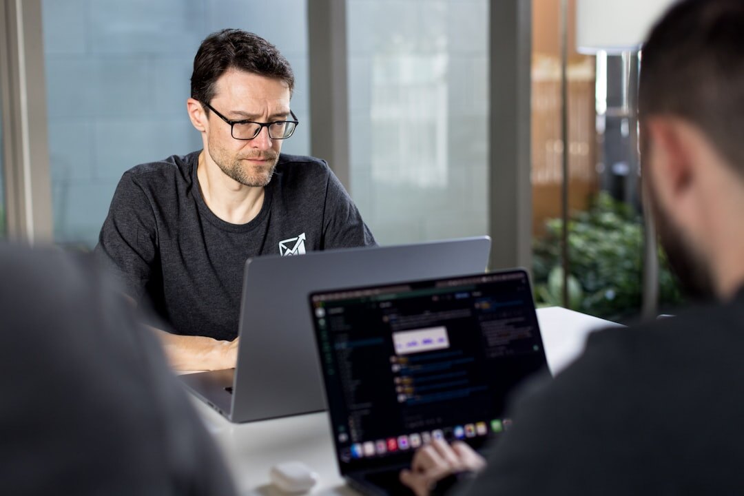 developer using laptop in office