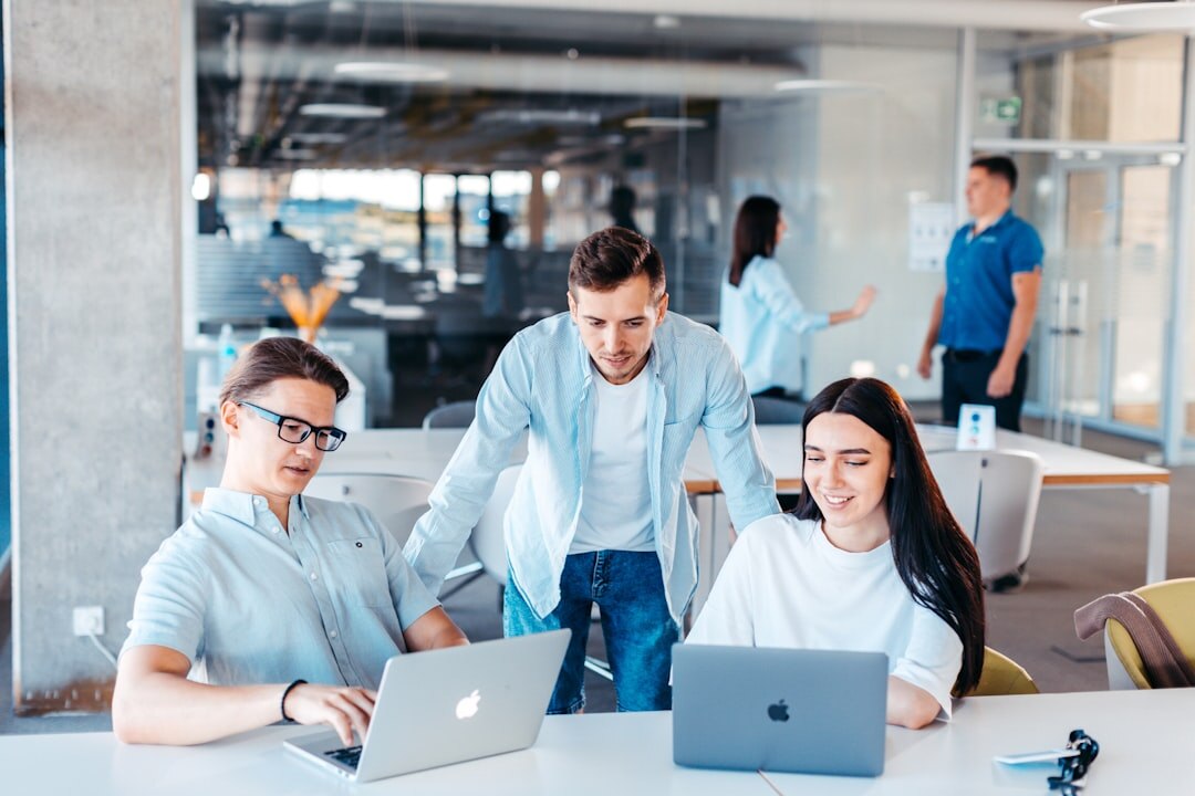 business professionals using laptop